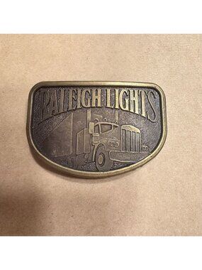 Vintage Raleigh Lights Brass Belt Buckle With Semi Truck Design